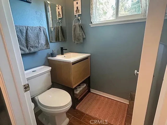 a bathroom with a toilet and a sink