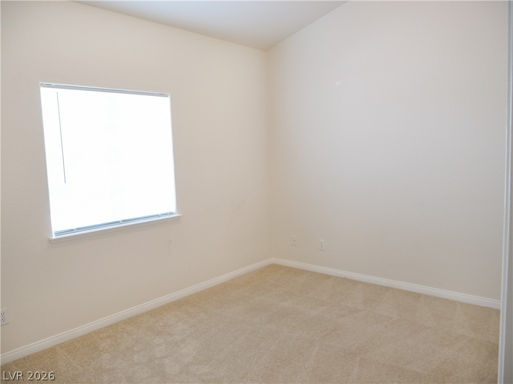1920 Racine Drive Las Vegas, NV 89156 - Photo 10 of 16 Bedroom #2 features closet, light carpet and window
