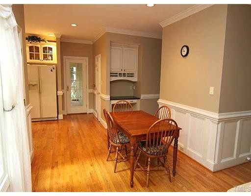 9000 Enfield Court Raleigh, NC 27615 - Photo 18 of 18 Wainscotting continues from the breakfast area (with desk niche) into the family room - a desirable open floor plan. Aerial View