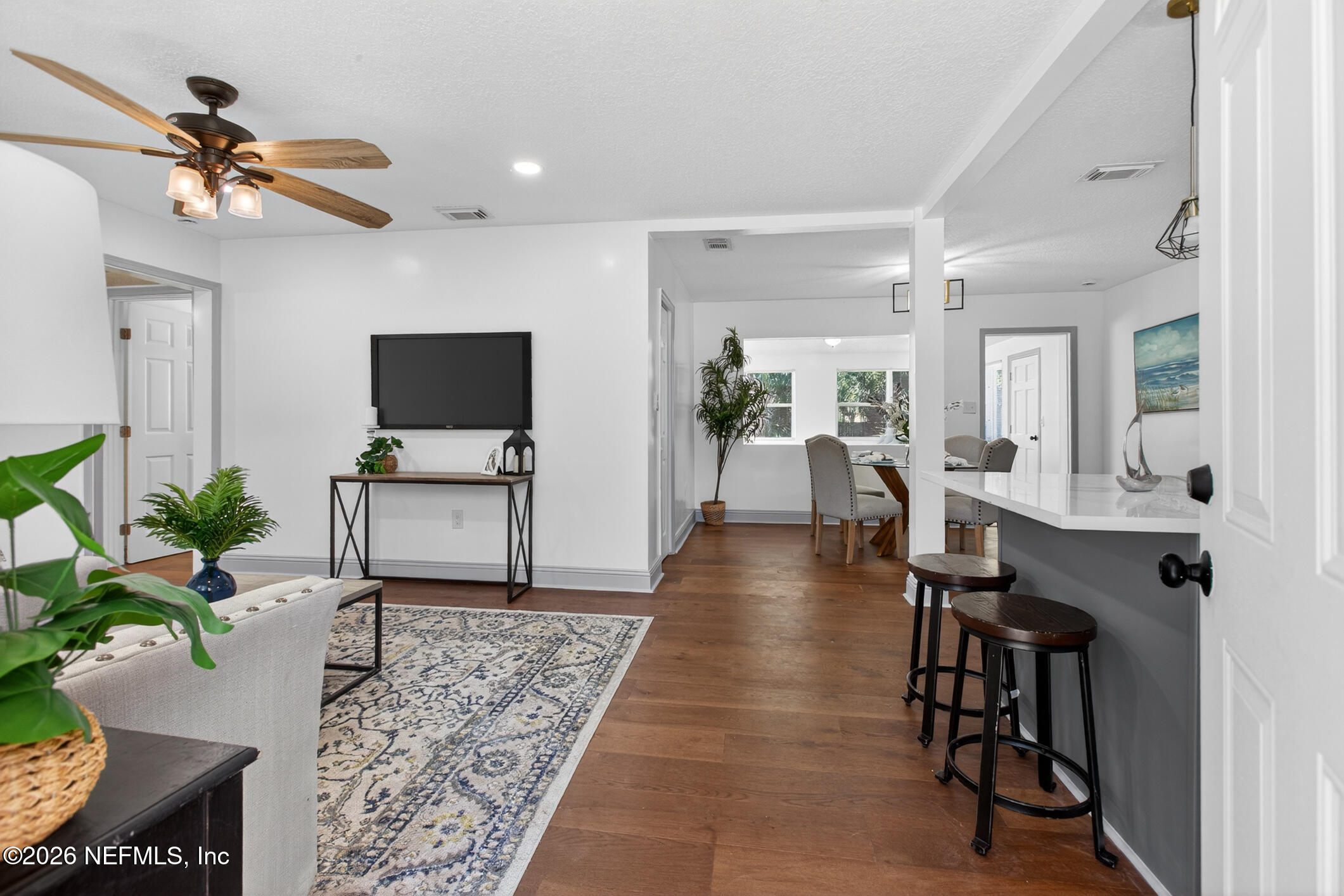 113 Menendez Road St. Augustine, FL 32080 - Photo 11 of 71 a living room with furniture a dining table and a potted plant