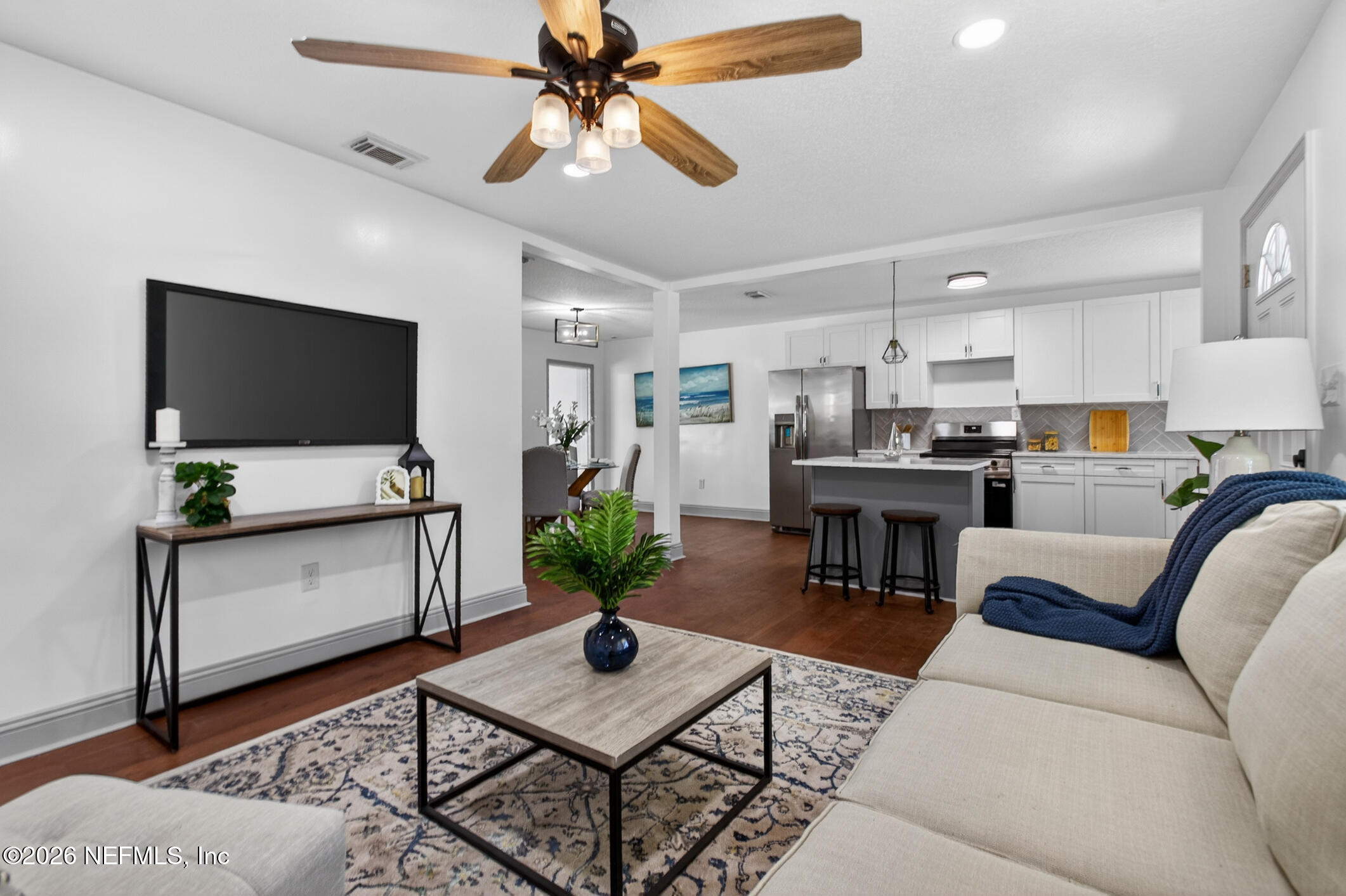113 Menendez Road St. Augustine, FL 32080 - Photo 15 of 71 a living room with furniture and a flat screen tv