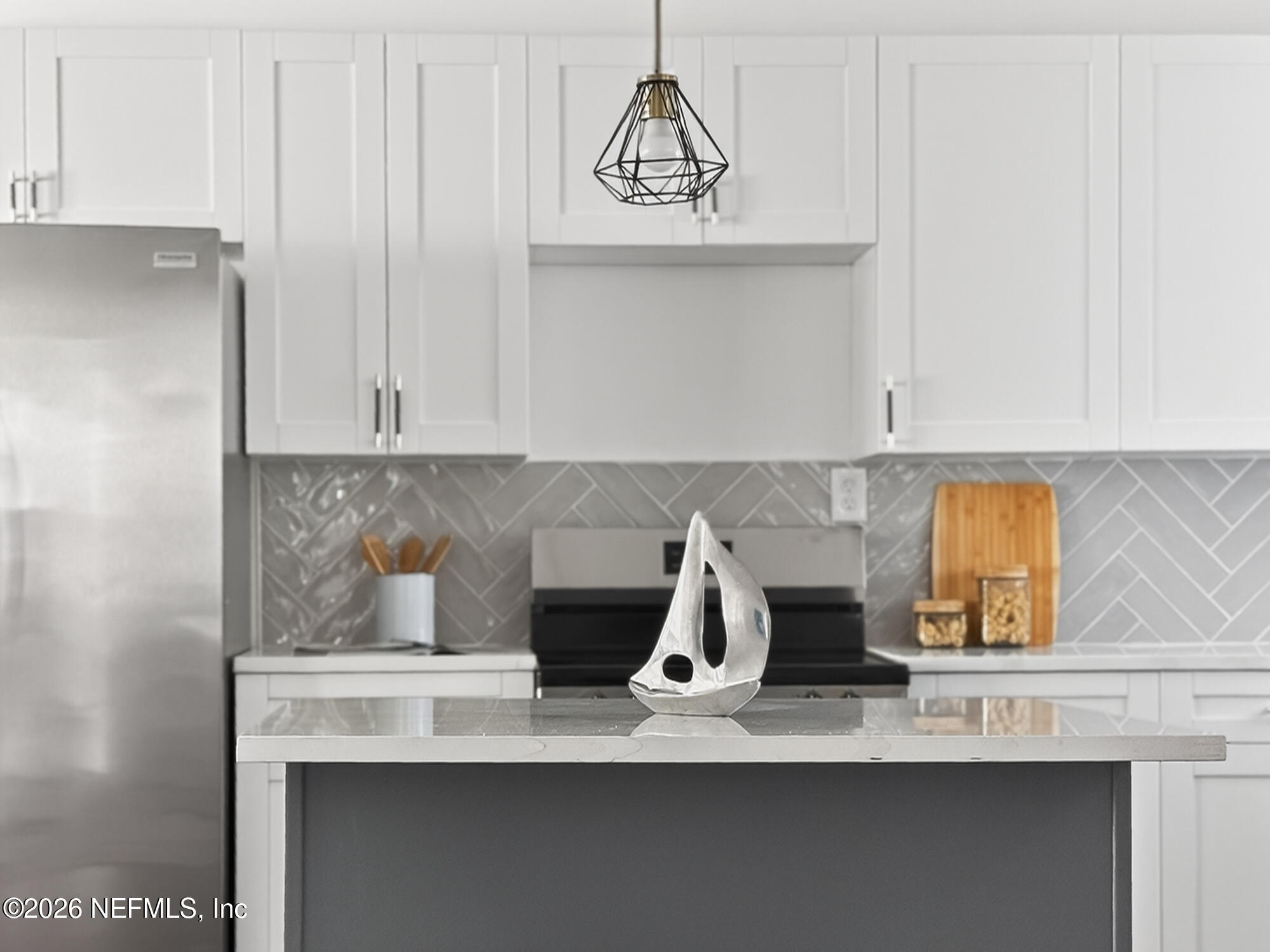 113 Menendez Road St. Augustine, FL 32080 - Photo 26 of 71 a kitchen with a sink a stove and cabinets