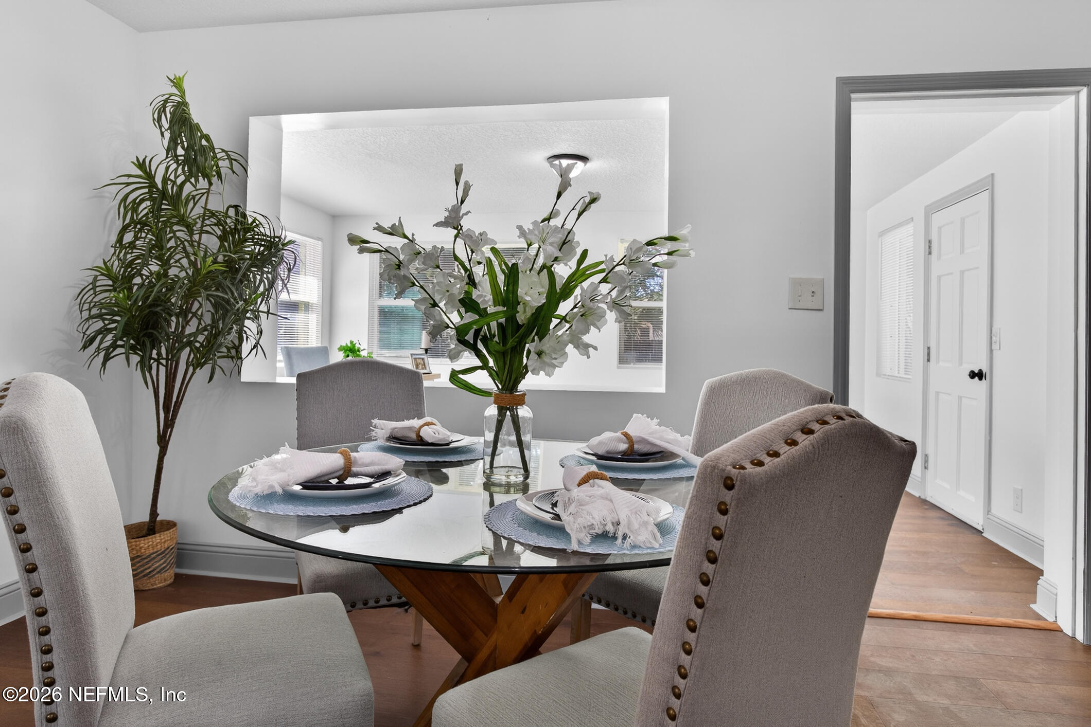 113 Menendez Road St. Augustine, FL 32080 - Photo 27 of 71 a view of a dining room with furniture window and wooden floor