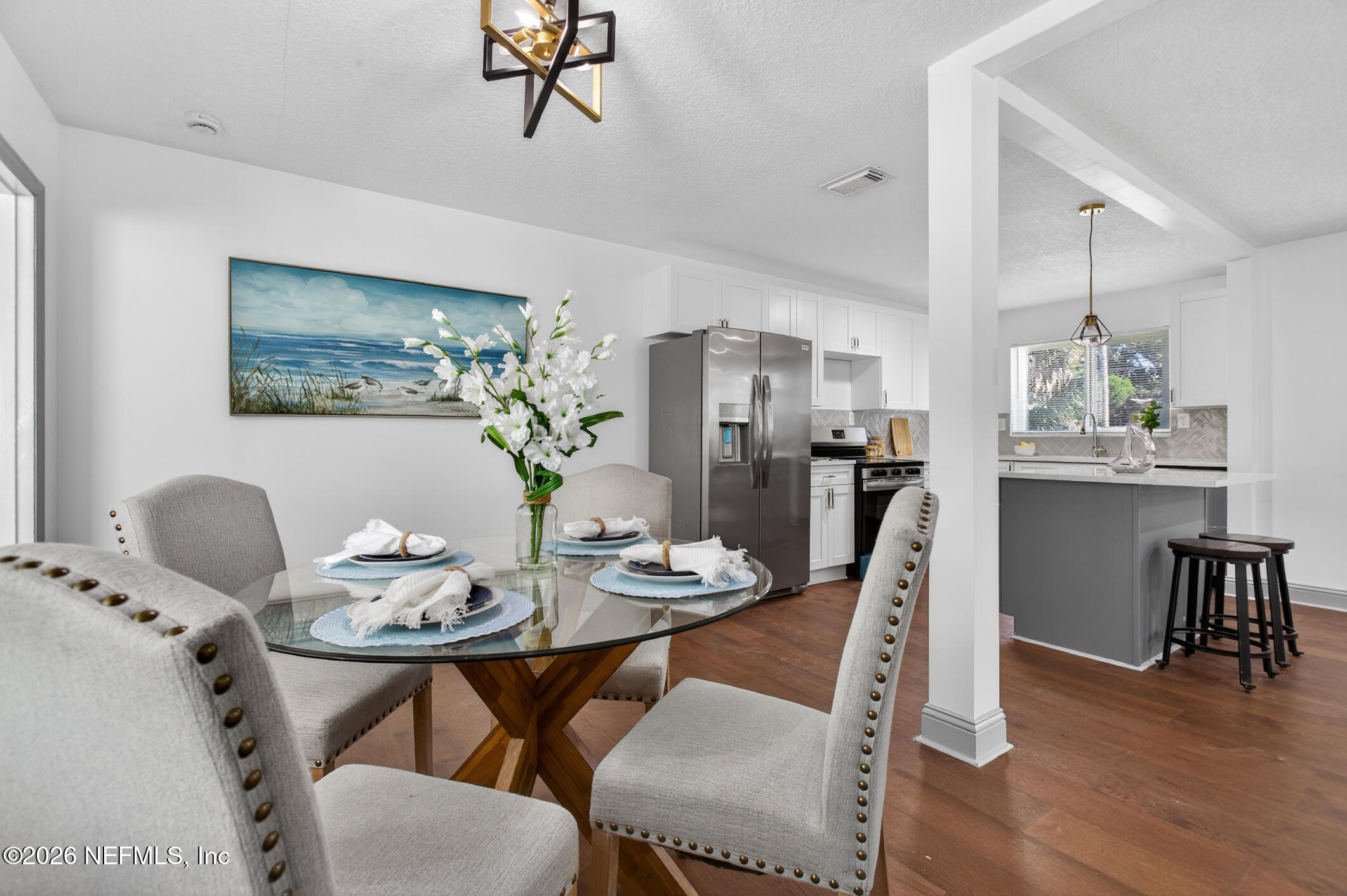 113 Menendez Road St. Augustine, FL 32080 - Photo 29 of 71 a dining room with furniture and wooden floor