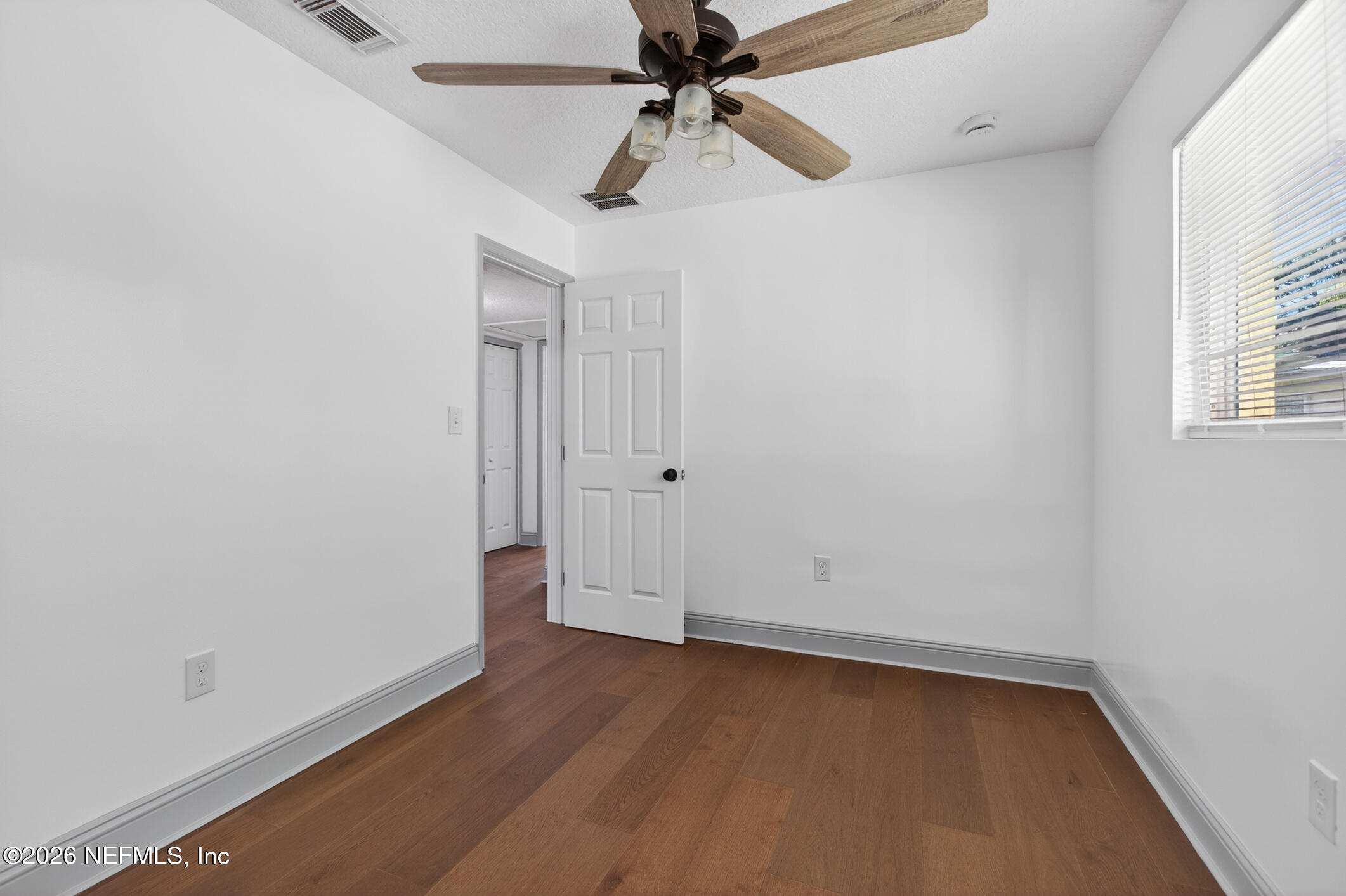 113 Menendez Road St. Augustine, FL 32080 - Photo 37 of 71 an empty room with a window and a ceiling fan