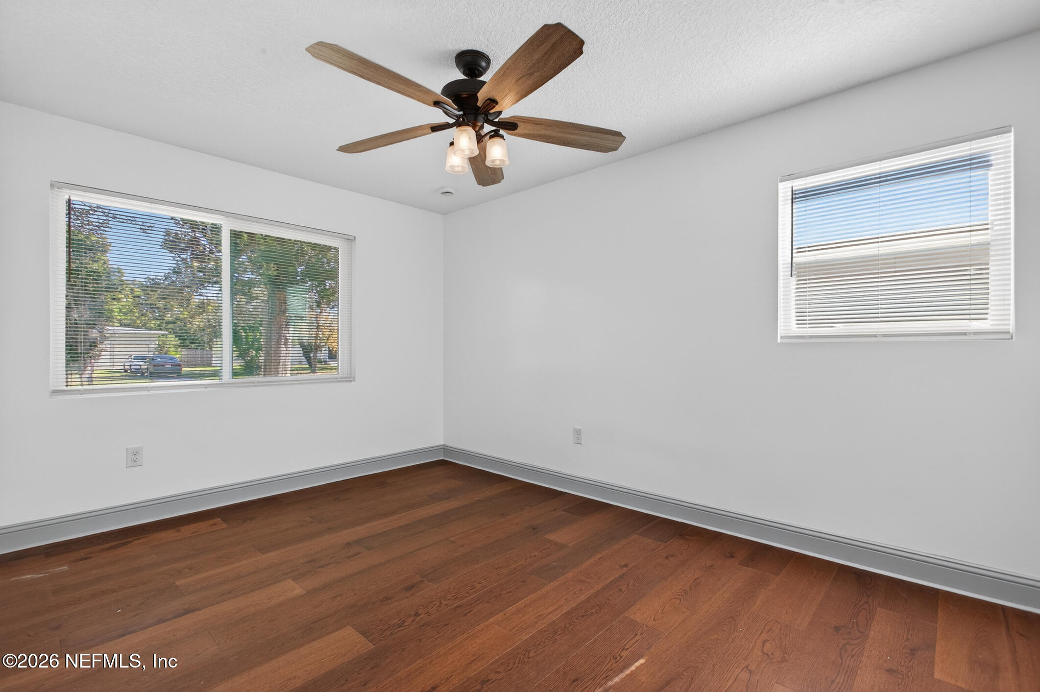 113 Menendez Road St. Augustine, FL 32080 - Photo 43 of 71 a view of an empty room with wooden floor and a window