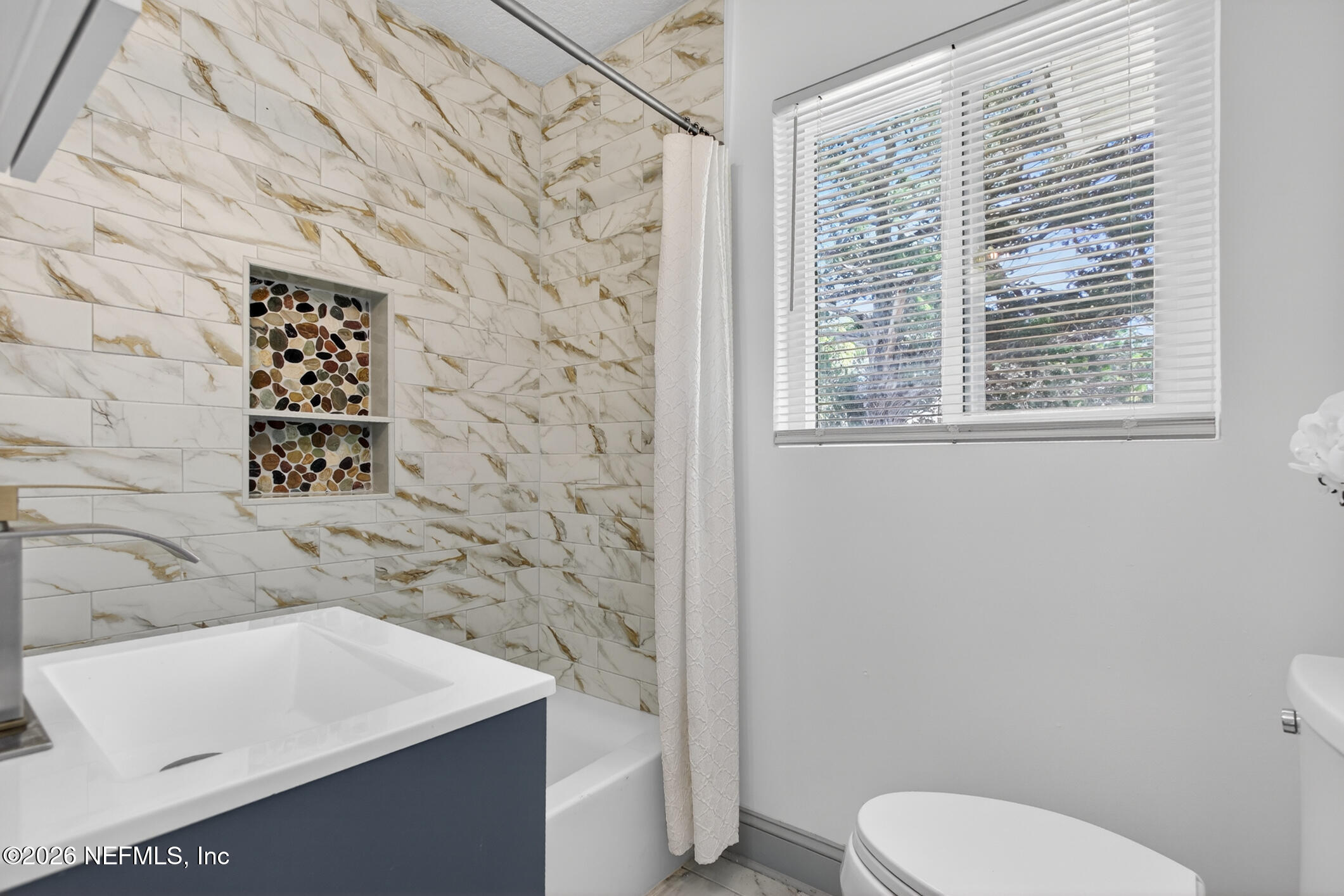 113 Menendez Road St. Augustine, FL 32080 - Photo 46 of 71 a bathroom with a toilet sink and a shower