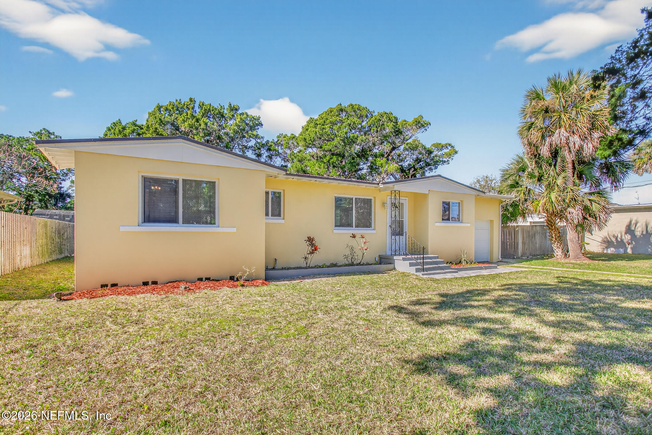 113 Menendez Road St. Augustine, FL 32080 - Photo 5 of 71 a front view of a house with a yard