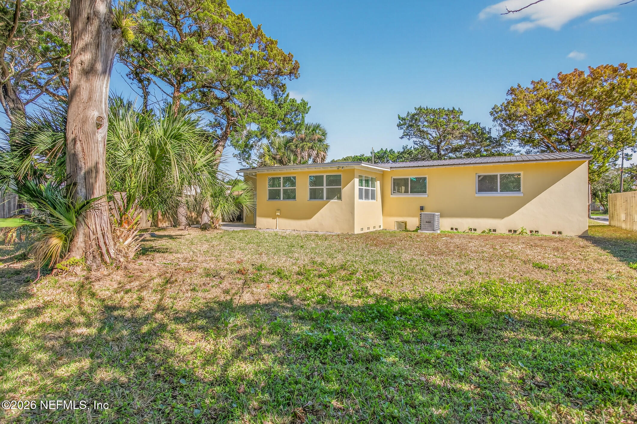 113 Menendez Road St. Augustine, FL 32080 - Photo 58 of 71 a front view of house with yard and trees around
