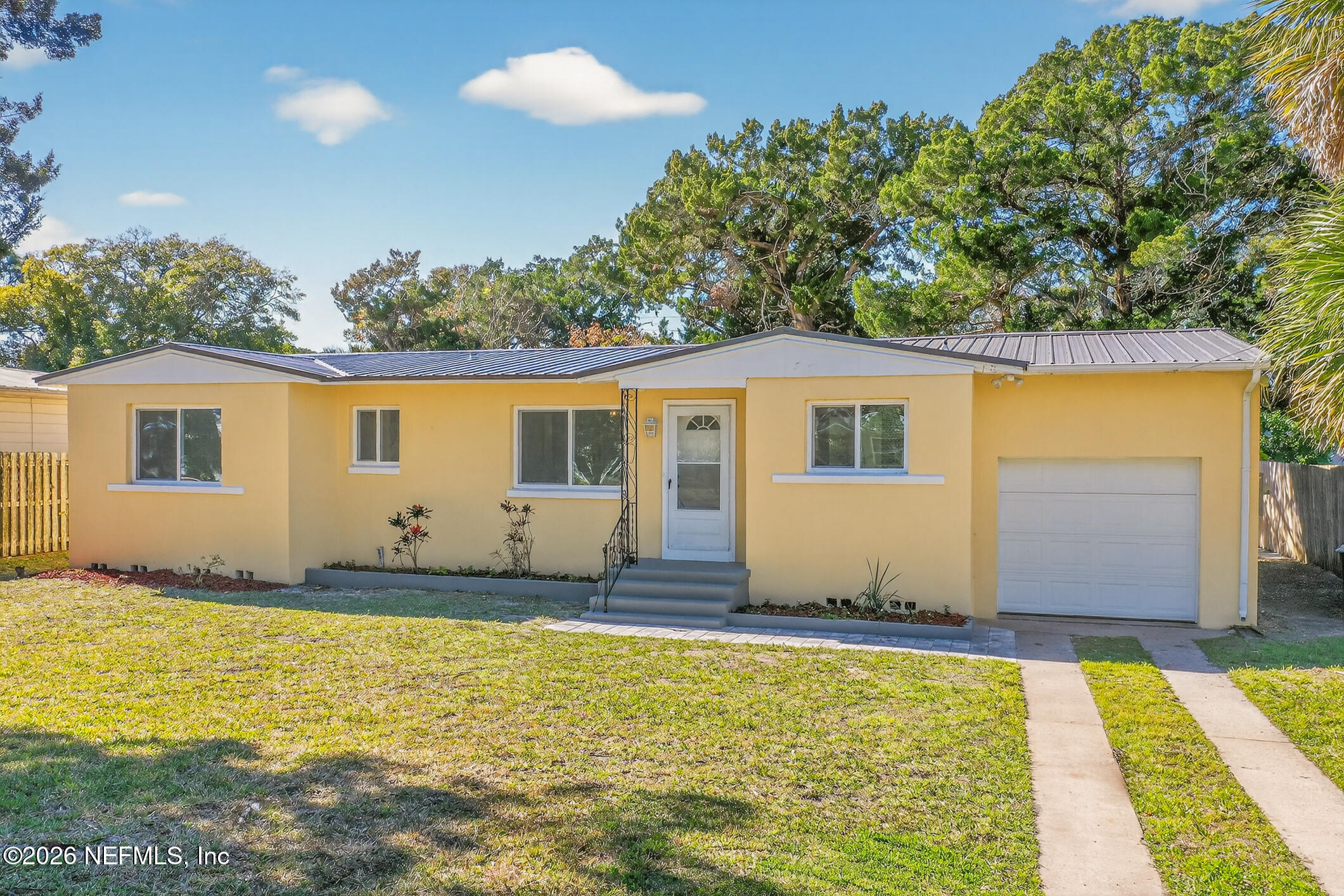 113 Menendez Road St. Augustine, FL 32080 - Photo 61 of 71 a front view of a house with a swimming pool