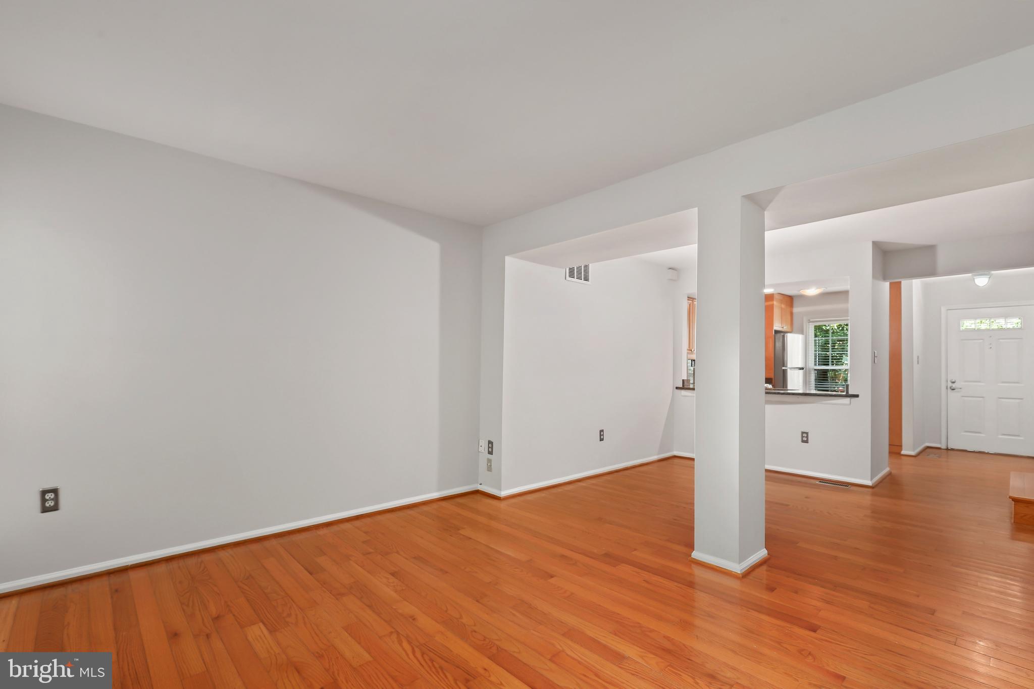 2434 South Walter Reed Drive, Unit 3 Arlington, VA 22206 - Photo 13 of 36 a view of empty room with wooden floor