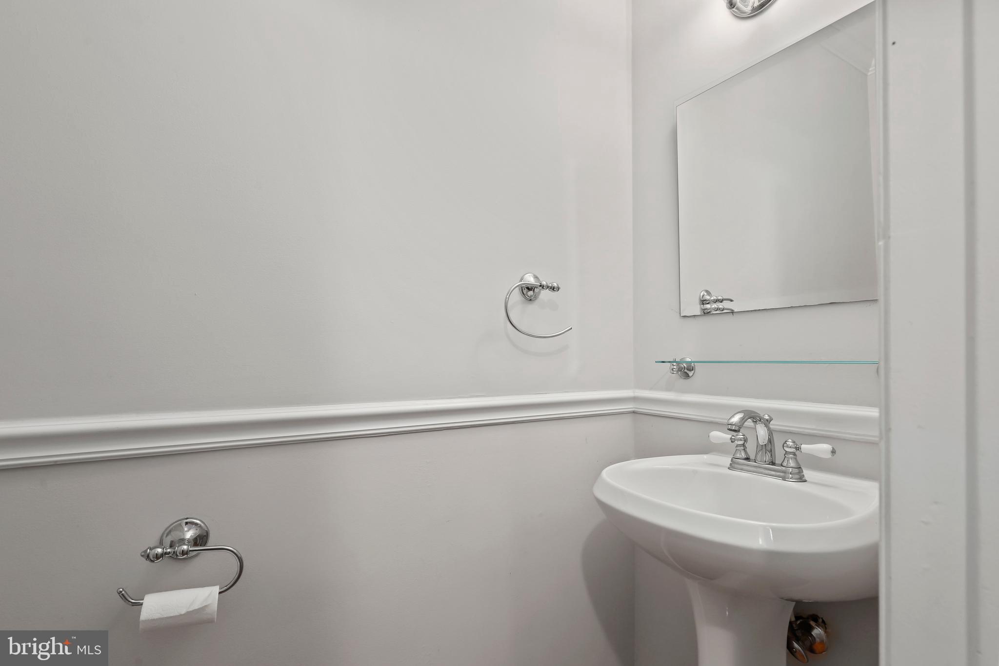 2434 South Walter Reed Drive, Unit 3 Arlington, VA 22206 - Photo 14 of 36 a bathroom with a sink a toilet and a mirror