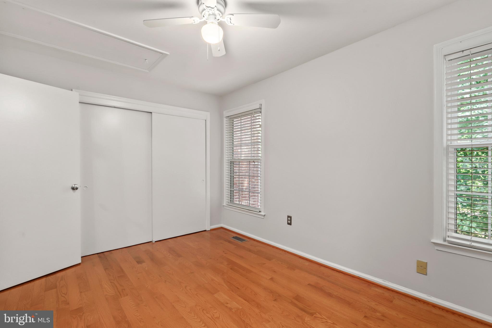 2434 South Walter Reed Drive, Unit 3 Arlington, VA 22206 - Photo 16 of 36 wooden floor in an empty room with a window