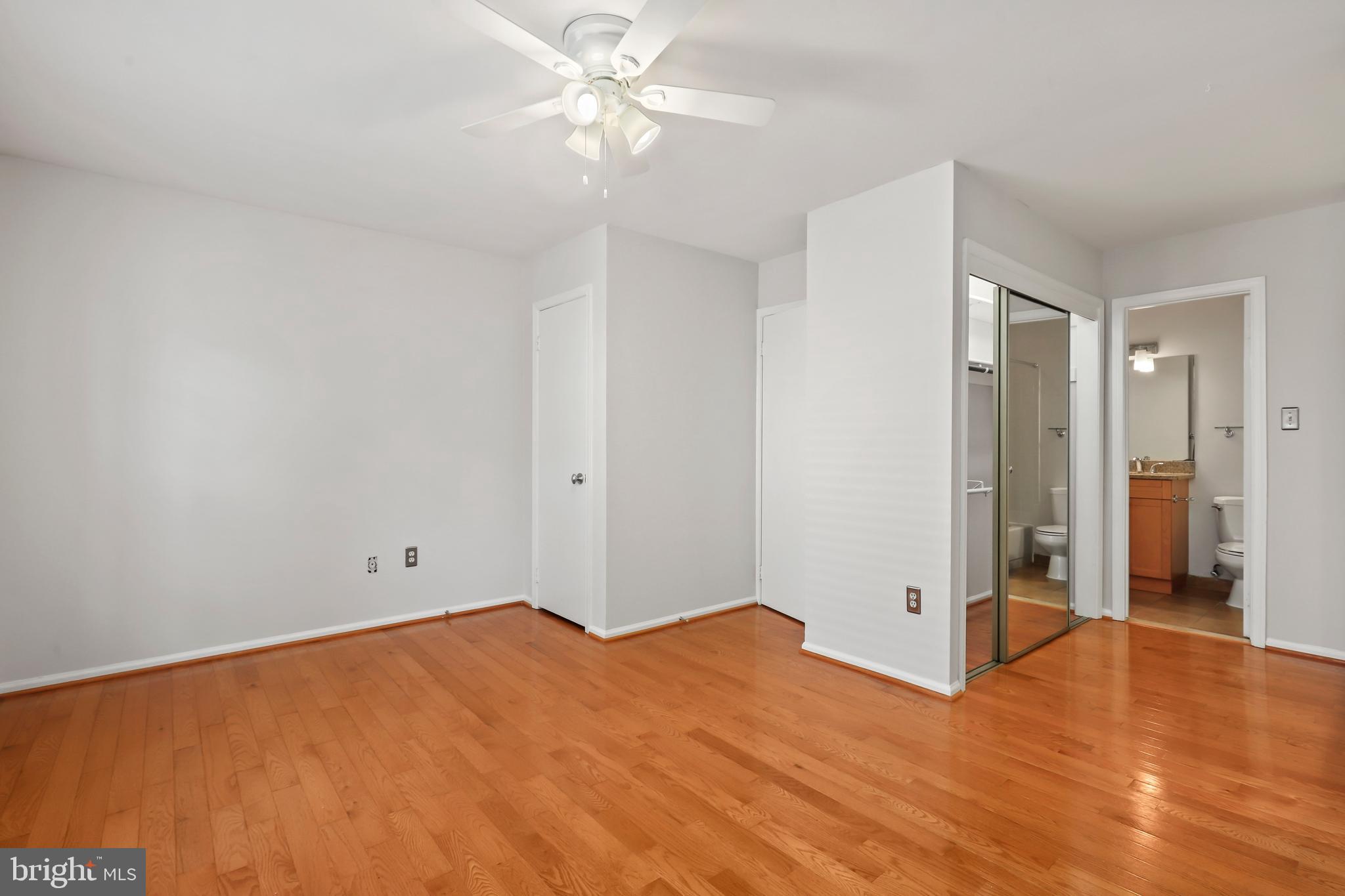 2434 South Walter Reed Drive, Unit 3 Arlington, VA 22206 - Photo 19 of 36 a view of empty room with wooden floor