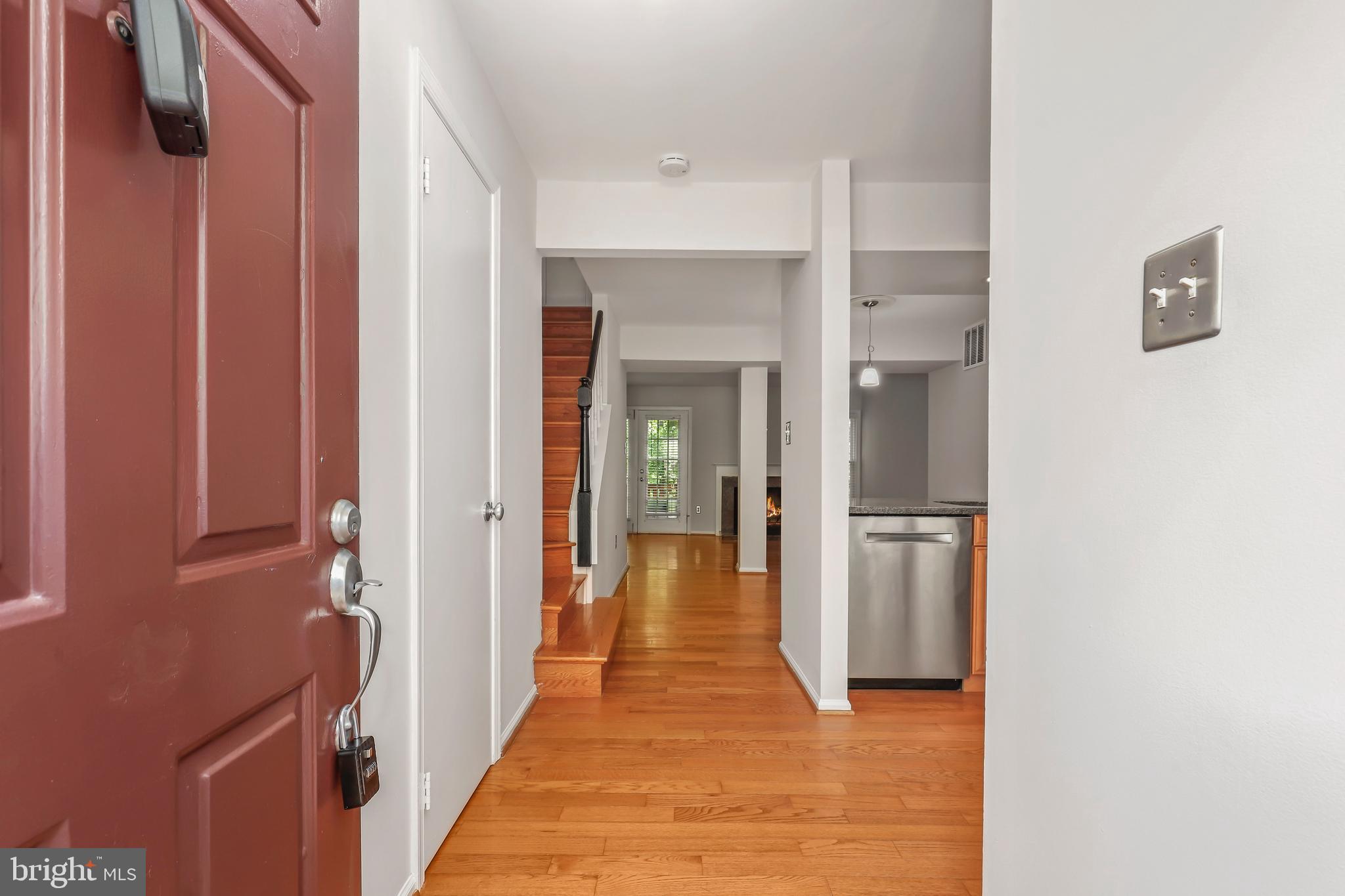 2434 South Walter Reed Drive, Unit 3 Arlington, VA 22206 - Photo 2 of 36 a view of a hallway with wooden floor and staircase