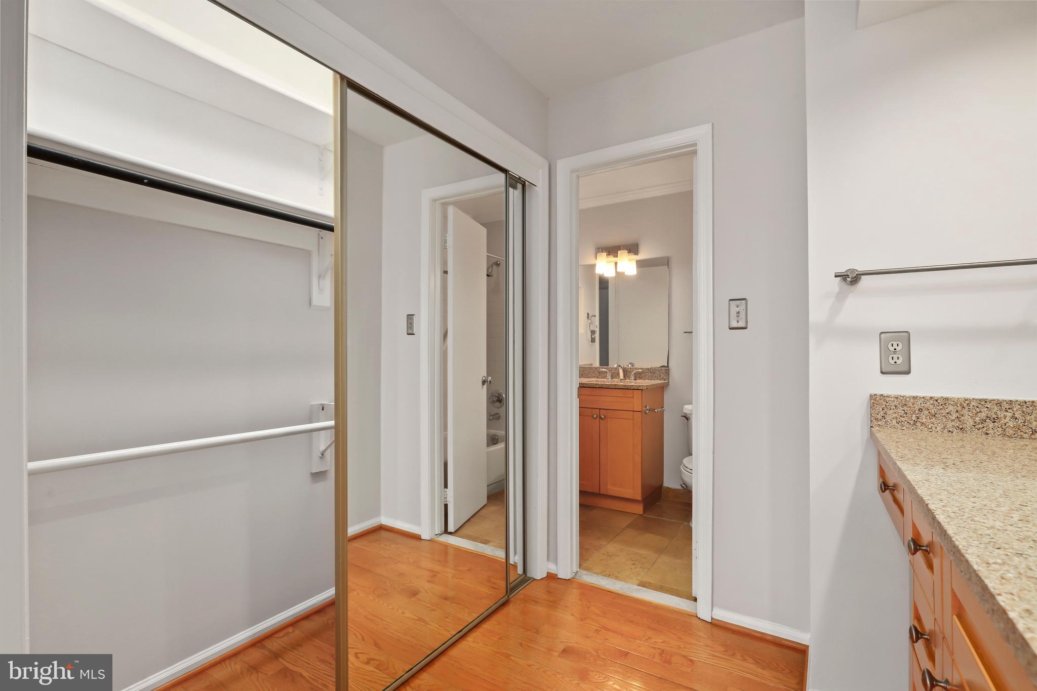 2434 South Walter Reed Drive, Unit 3 Arlington, VA 22206 - Photo 23 of 36 a view of hallway with bathroom and a sink