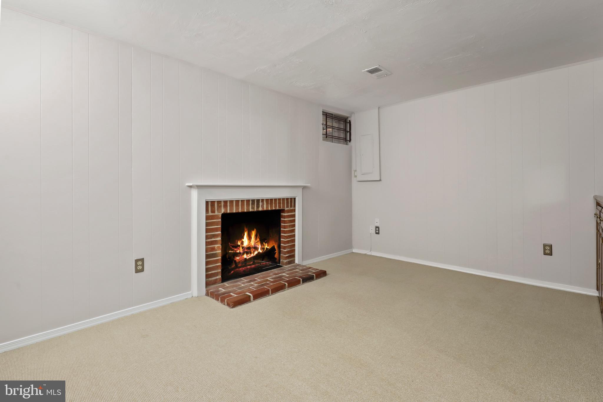 2434 South Walter Reed Drive, Unit 3 Arlington, VA 22206 - Photo 28 of 36 a living room with a fireplace