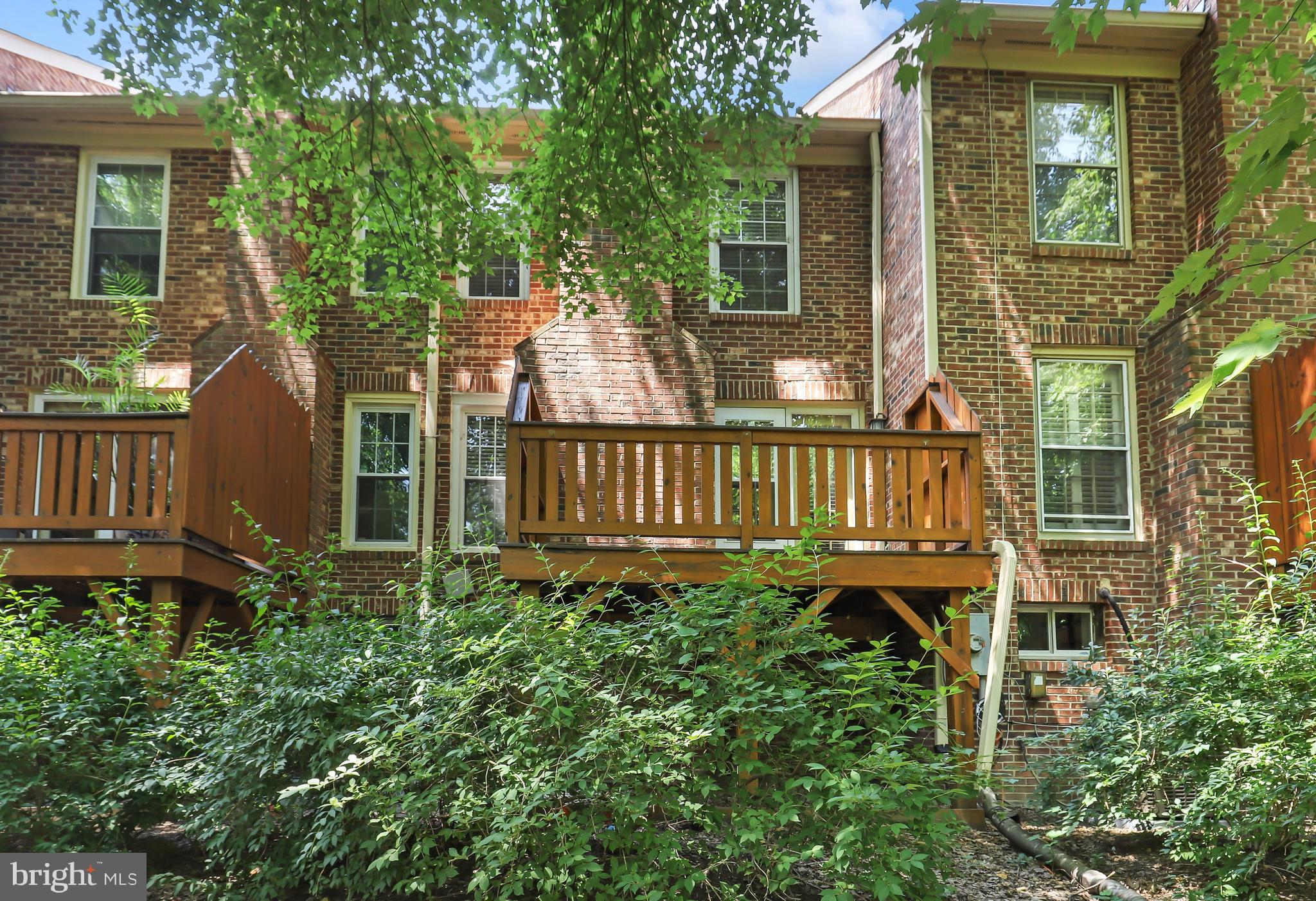 2434 South Walter Reed Drive, Unit 3 Arlington, VA 22206 - Photo 36 of 36 front view of a house with a small yard