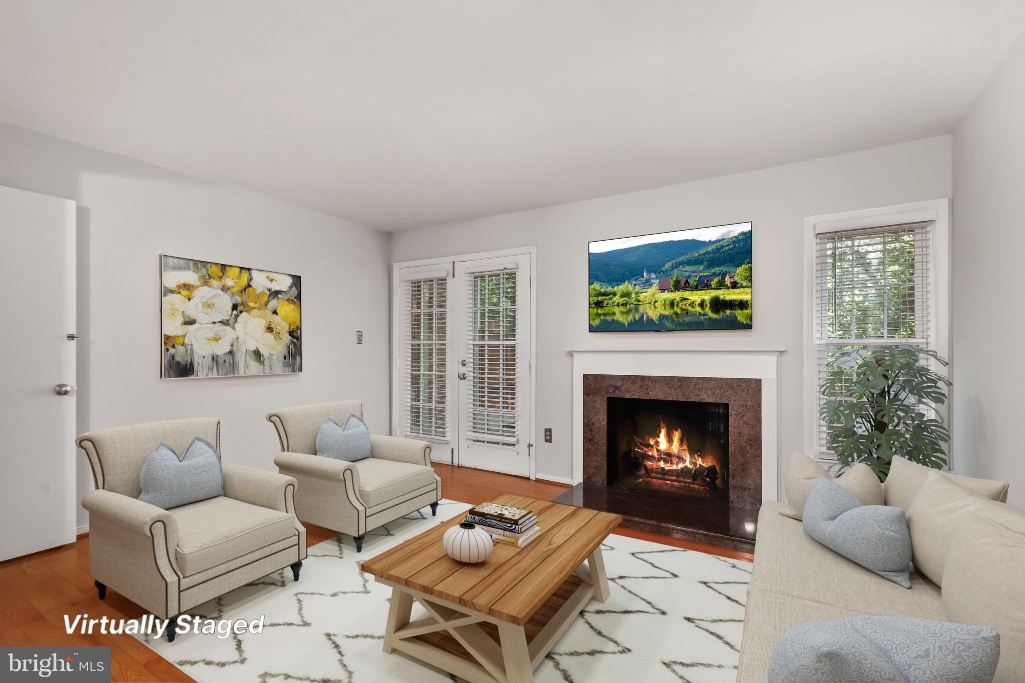 2434 South Walter Reed Drive, Unit 3 Arlington, VA 22206 - Photo 10 of 36 a living room with furniture and a fireplace