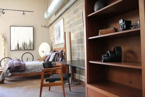 a view of a room with two chairs and a window