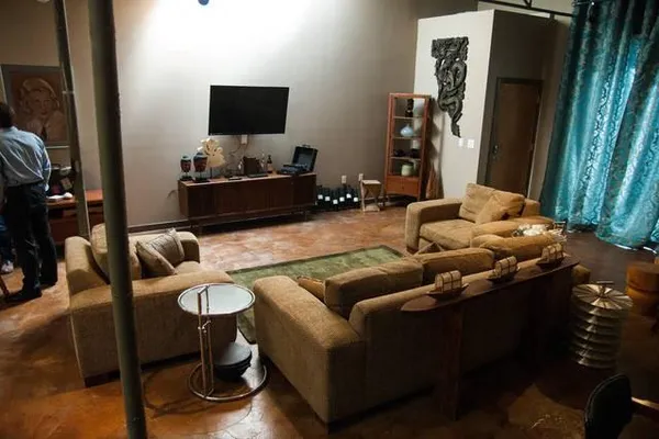 a living room with furniture and a flat screen tv