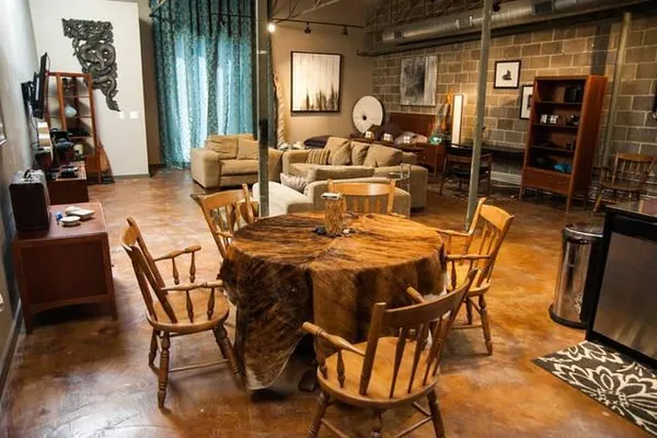 a dining room with furniture and window