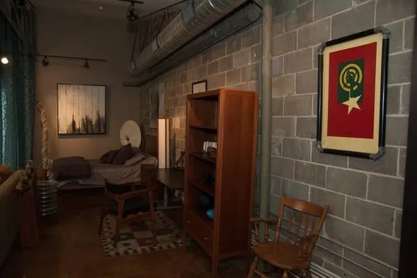 a front view of a house with outdoor seating