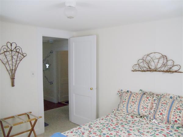 14 Bayview Road Marion, MA 02738 - Photo 13 of 22 a bedroom with a bed and a table in it