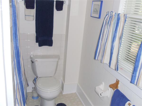 14 Bayview Road Marion, MA 02738 - Photo 15 of 22 a white toilet sitting next to a bathroom sink and vanity