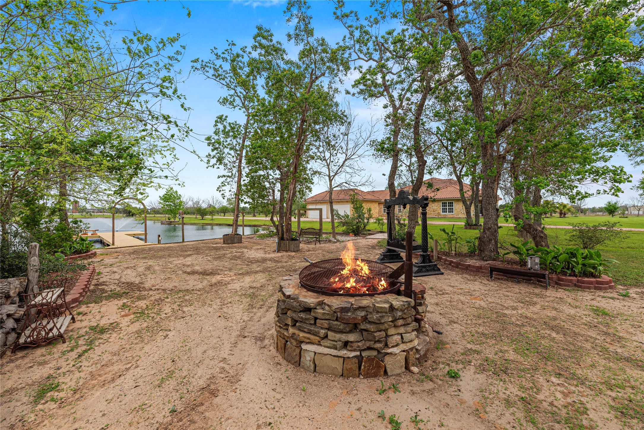 6306 Farm To Market 359 Fulshear, TX 77441 - Photo 33 of 44 Located near the water's edge, this dedicated picnic area features a custom stone fire pit and is fully plumbed with permanent water and electrical service.