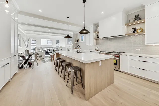 a kitchen with a sink stove and cabinets