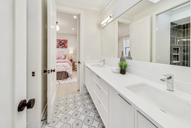 a spacious bathroom with a sink and a mirror