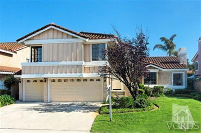 12522 Spring Creek Road Moorpark, CA 93021 - Photo 1 of 20 a front view of a house with a yard and garage