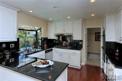 12522 Spring Creek Road Moorpark, CA 93021 - Photo 13 of 20 a kitchen with stainless steel appliances wooden floor and a counter top space
