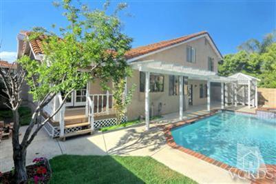 12522 Spring Creek Road Moorpark, CA 93021 - Photo 15 of 20 a front view of a house with a garden