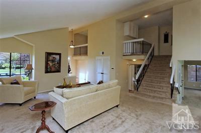 12522 Spring Creek Road Moorpark, CA 93021 - Photo 4 of 20 a living room with furniture and a stairs