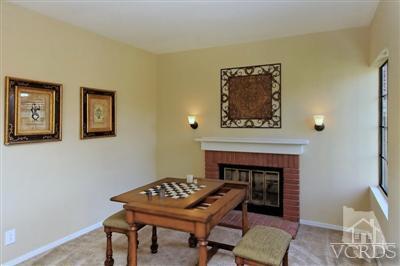 12522 Spring Creek Road Moorpark, CA 93021 - Photo 7 of 20 a living room with a table and a fireplace