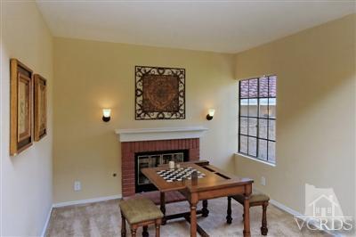 12522 Spring Creek Road Moorpark, CA 93021 - Photo 8 of 20 a dining room with furniture and a fireplace