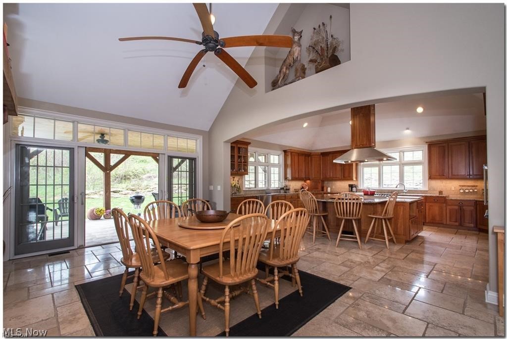 12430 Falcon Ridge Road Chesterland, OH 44026 - Photo 6 of 28 Just an amazing open kitchen and breakfast
room, with see-through stone fireplace and
sliding doors to sprawling covered patio!