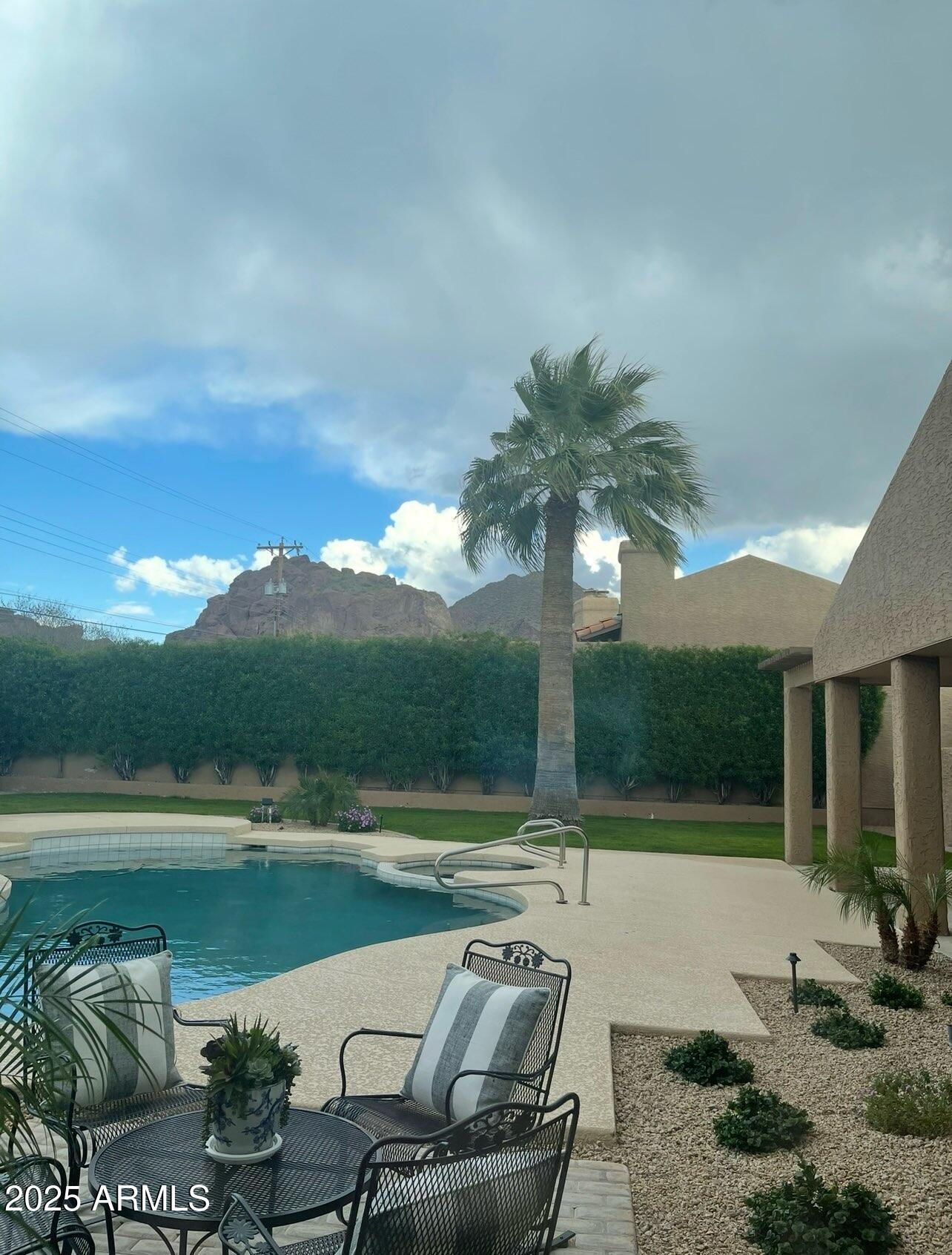 4436 East Camelback Road, Unit 37 Phoenix, AZ 85018 - Photo 13 of 55 a terrace with outdoor seating and lake view