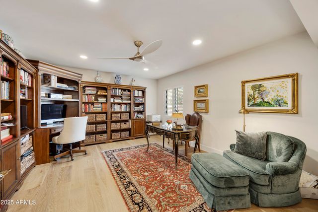 a spacious bathroom with a double vanity sink a mirror and a shower