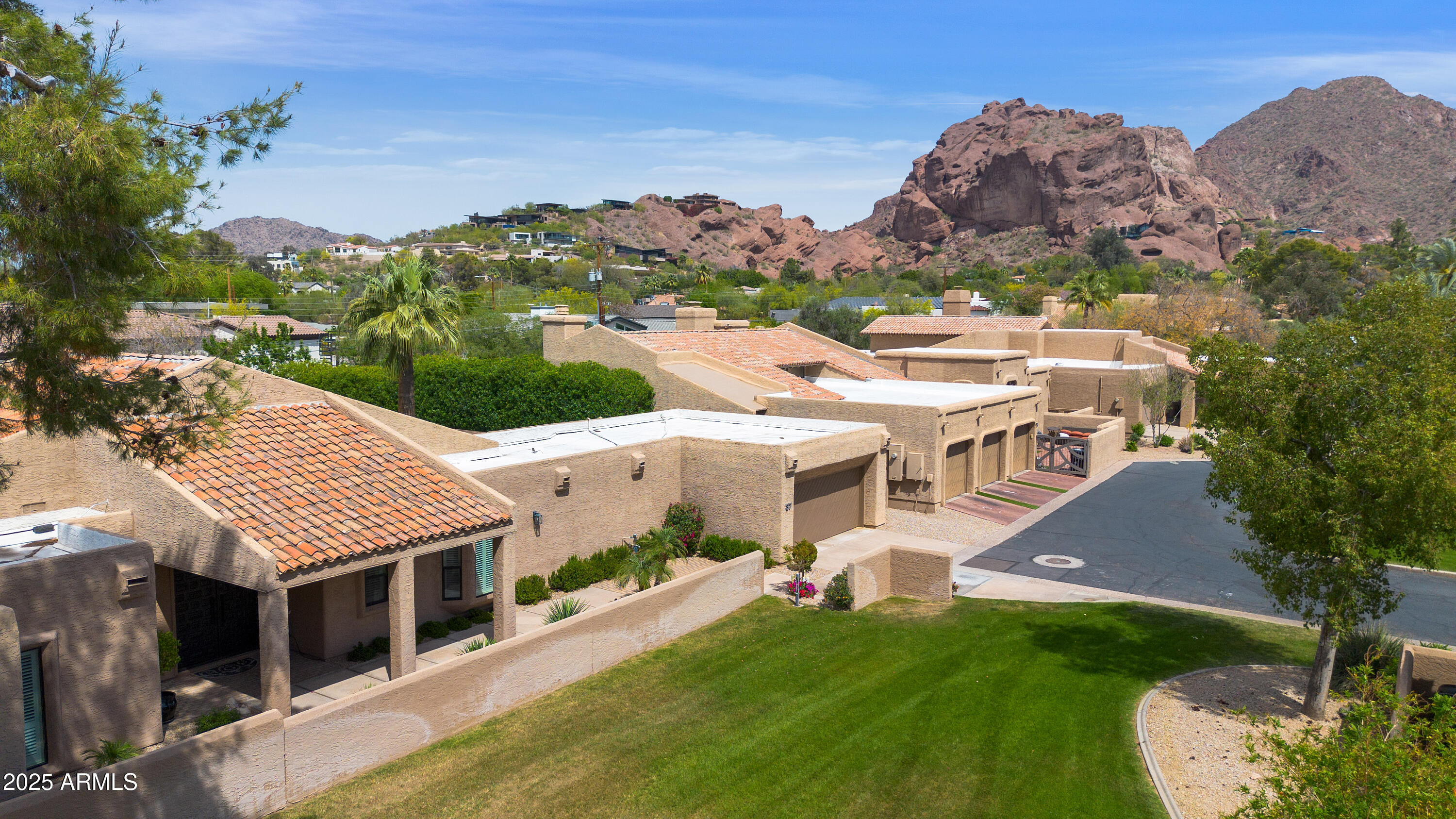 4436 East Camelback Road, Unit 37 Phoenix, AZ 85018 - Photo 2 of 55 an aerial view of a house with a garden