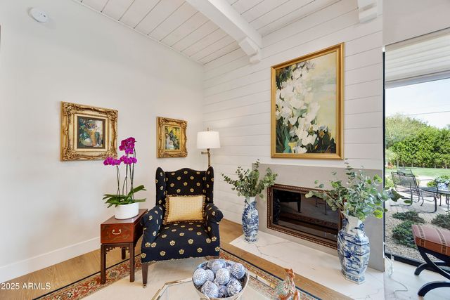 a view of a hallway with furniture and window