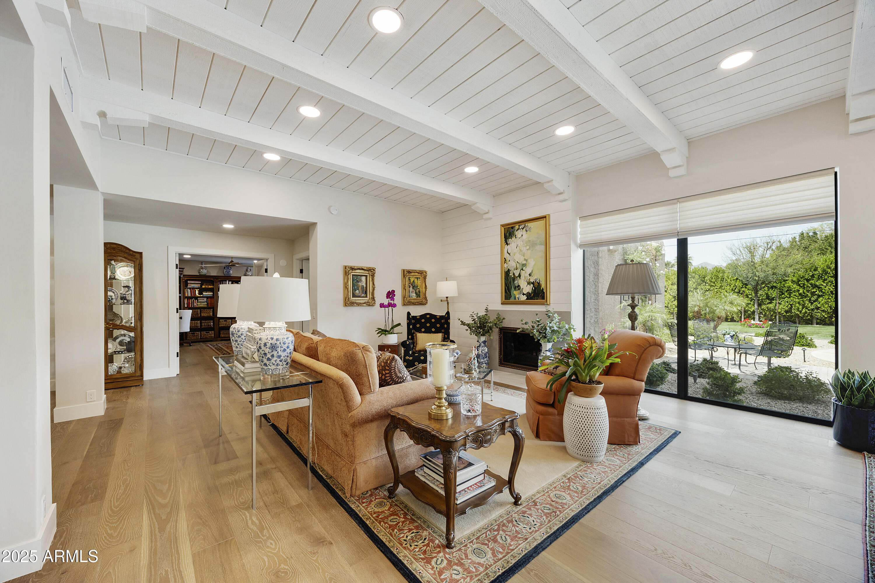 4436 East Camelback Road, Unit 37 Phoenix, AZ 85018 - Photo 26 of 55 a living room with furniture large windows and a table
