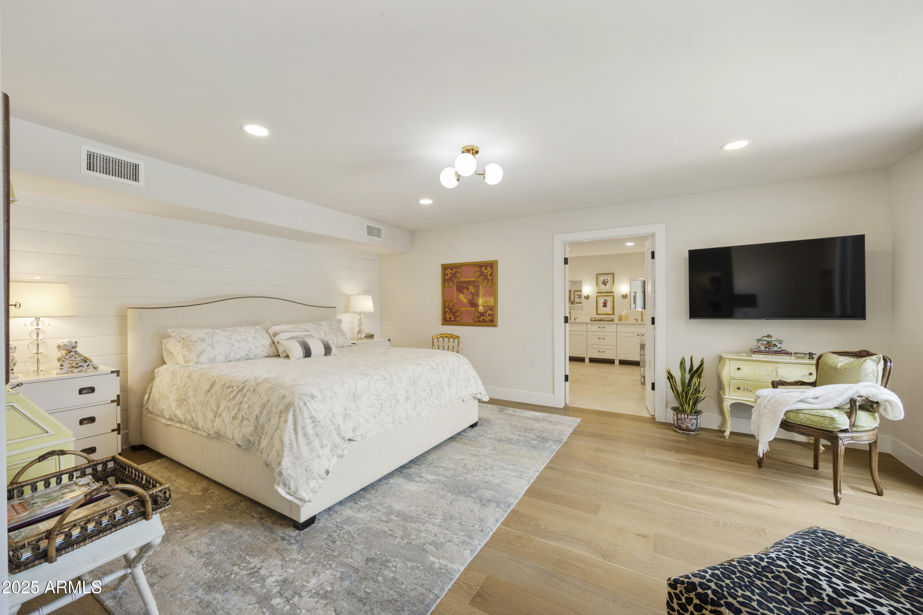 4436 East Camelback Road, Unit 37 Phoenix, AZ 85018 - Photo 33 of 55 a bedroom with a bed and a flat screen tv