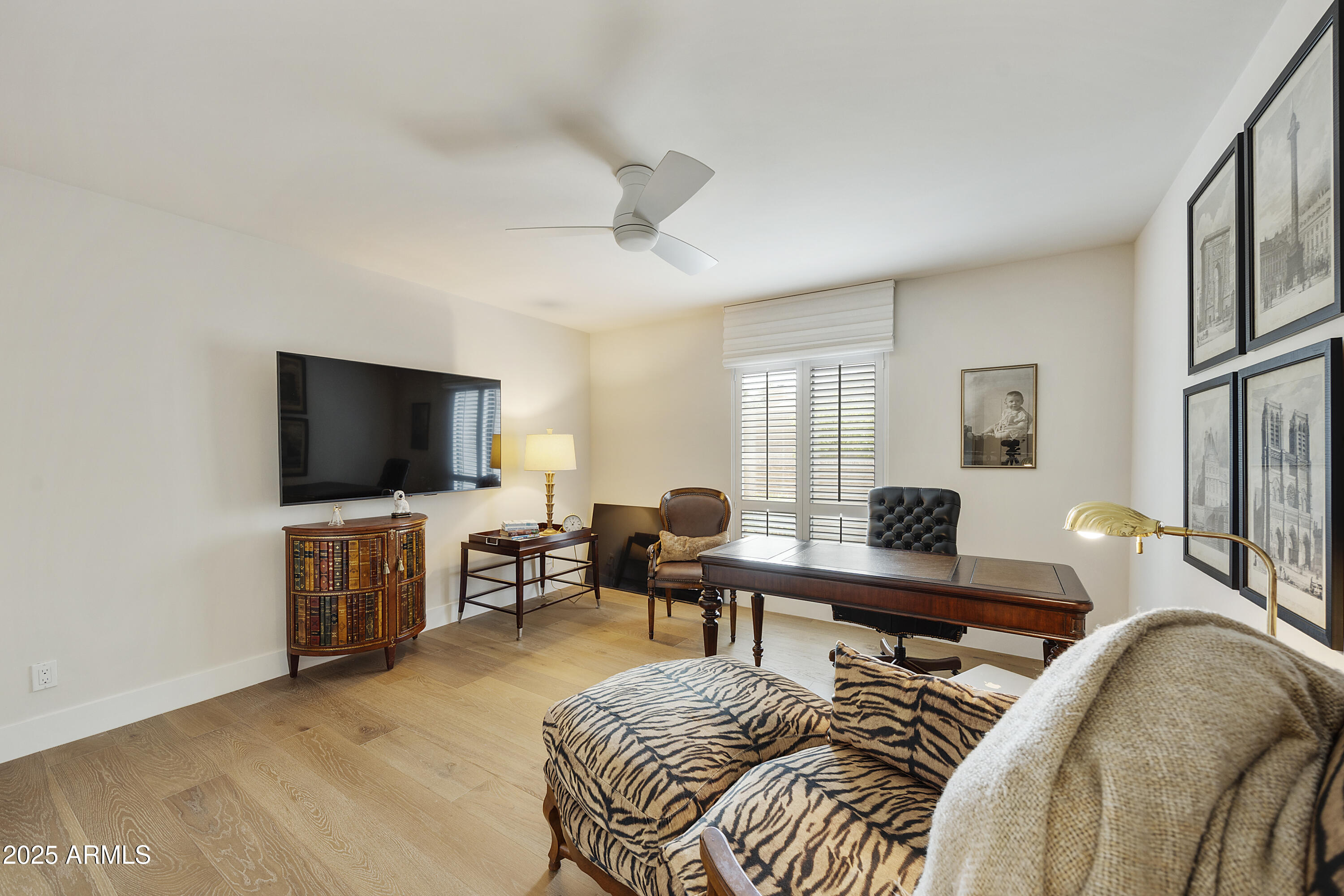 4436 East Camelback Road, Unit 37 Phoenix, AZ 85018 - Photo 42 of 55 a view of a livingroom with furniture and a flat screen tv