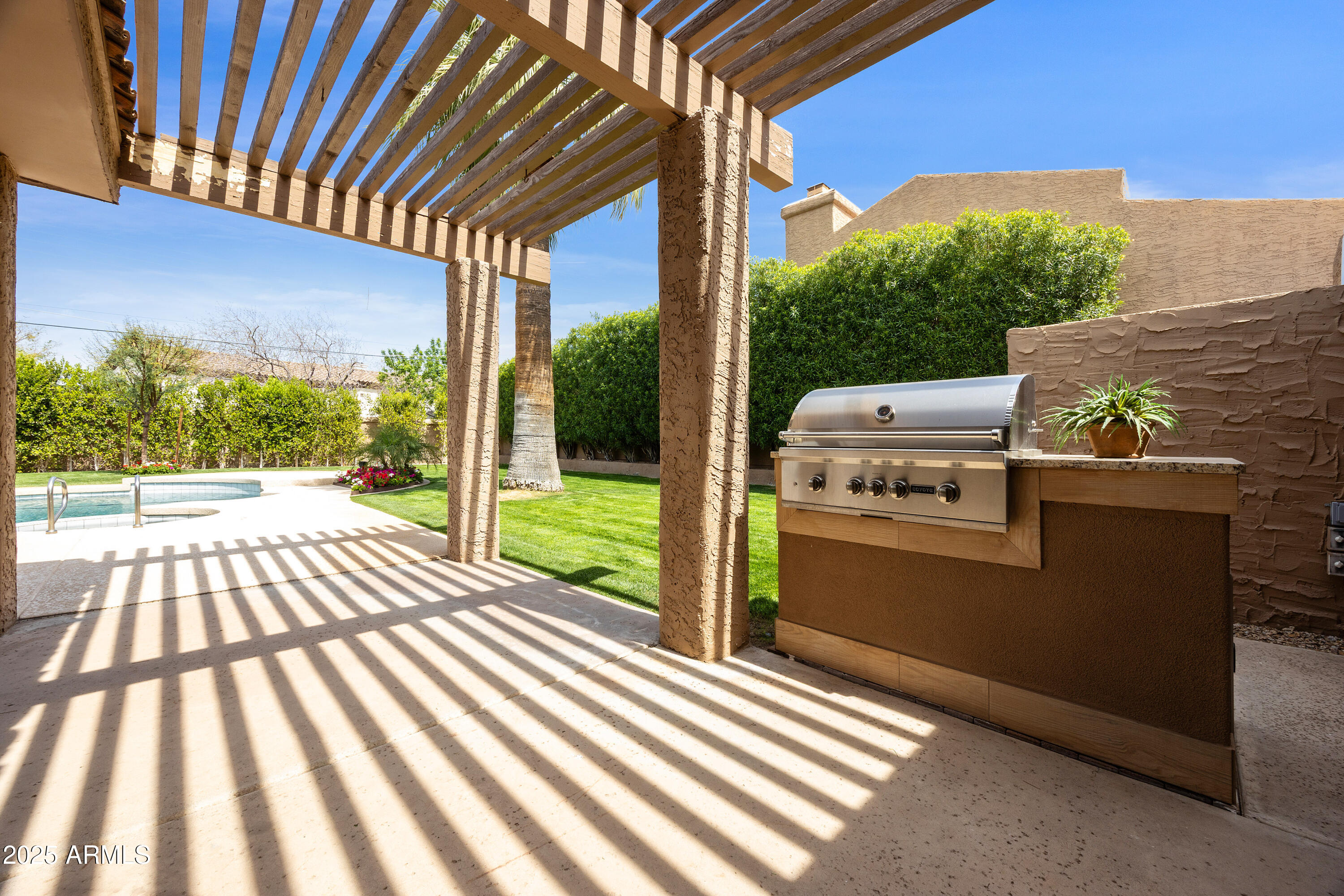 4436 East Camelback Road, Unit 37 Phoenix, AZ 85018 - Photo 44 of 55 a view of a patio with wooden fence