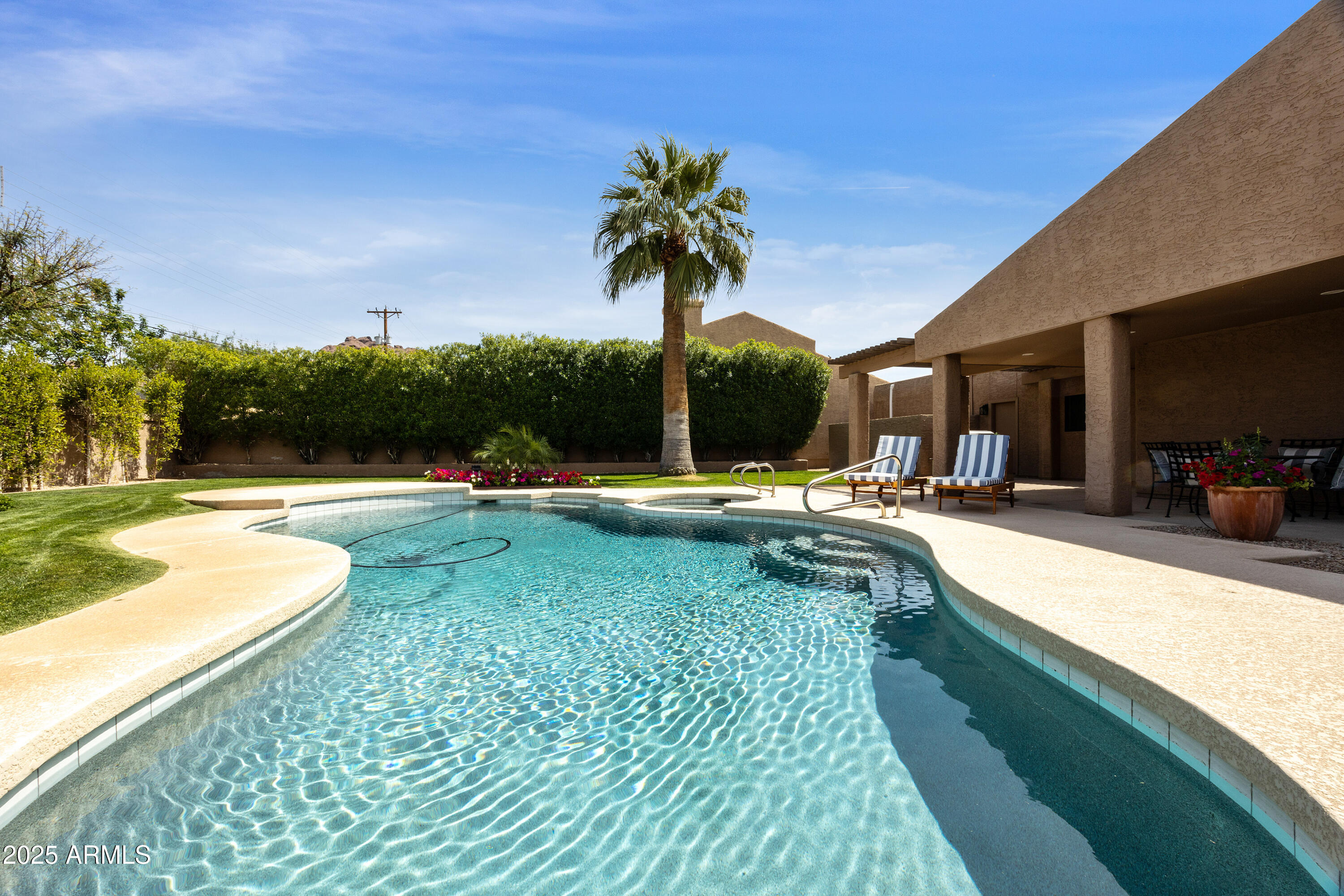 4436 East Camelback Road, Unit 37 Phoenix, AZ 85018 - Photo 48 of 55 a view of a swimming pool with a patio