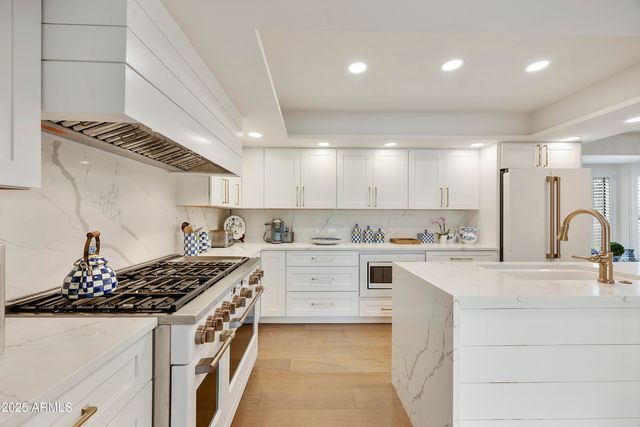 a terrace with outdoor seating and lake view