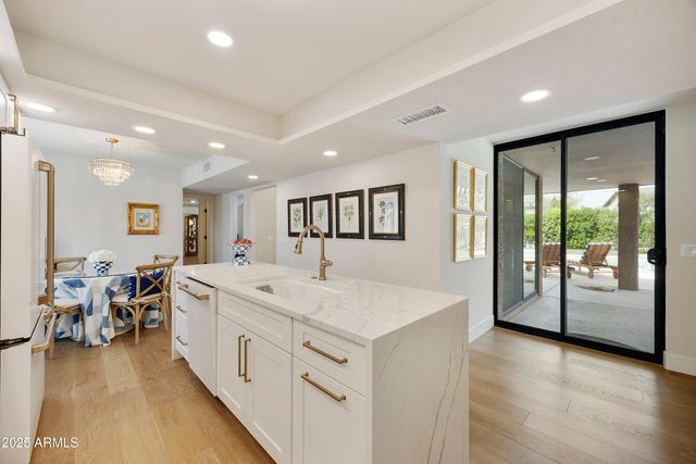 a view of a house with swimming pool and a yard